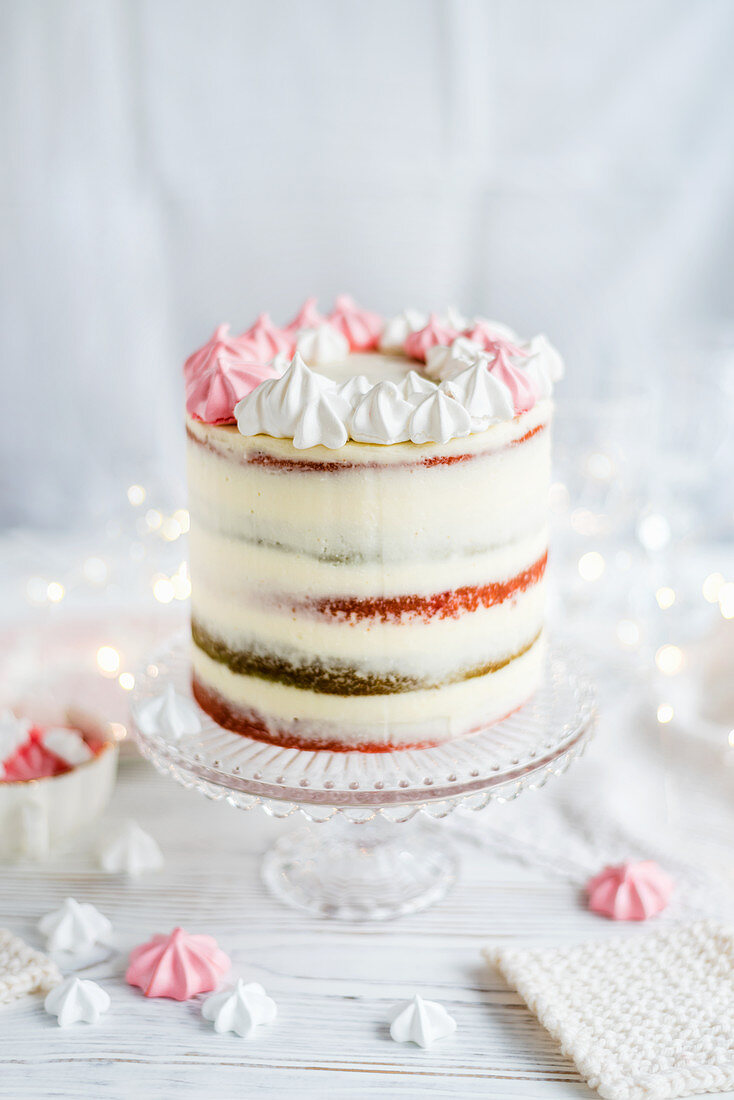 Cranberry vanilla layer cake with a meringue wreath