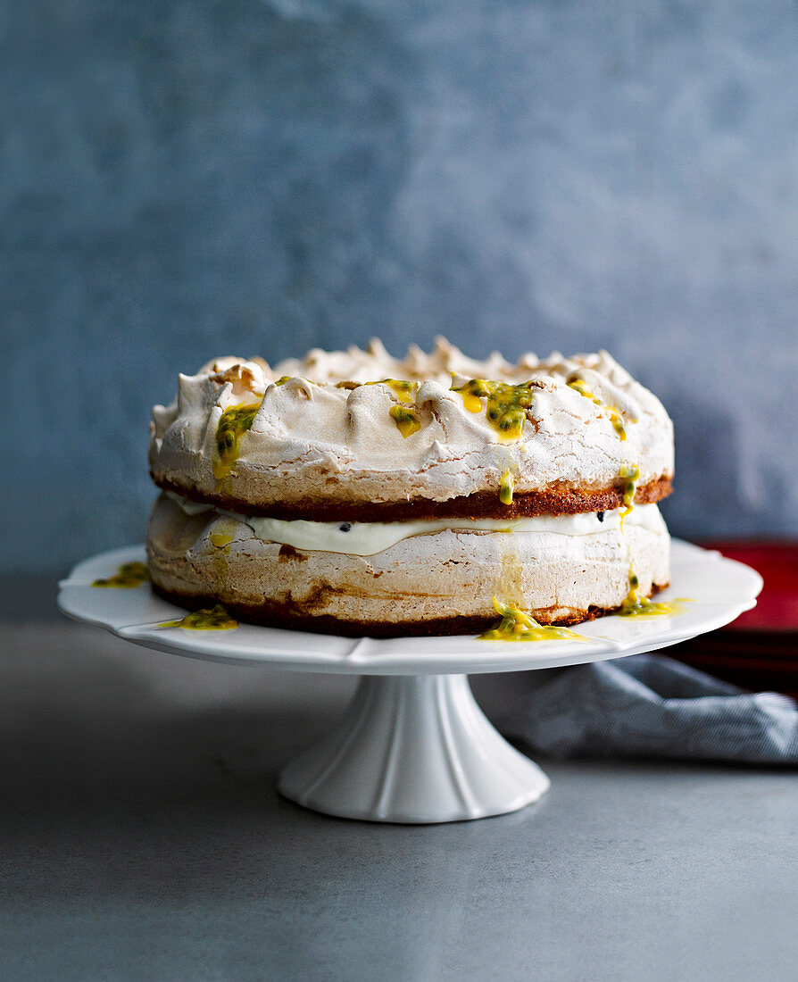 Passion fruit meringue cake on a cake stand
