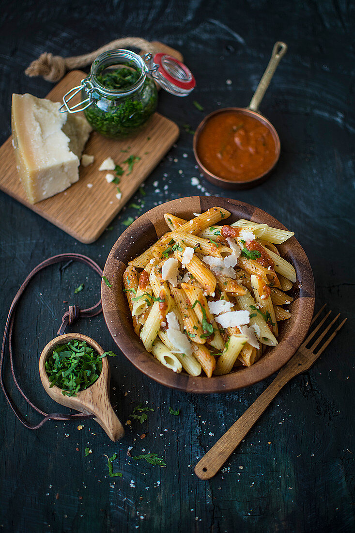 Penne with tomato sauce, pesto and Parmesan cheese