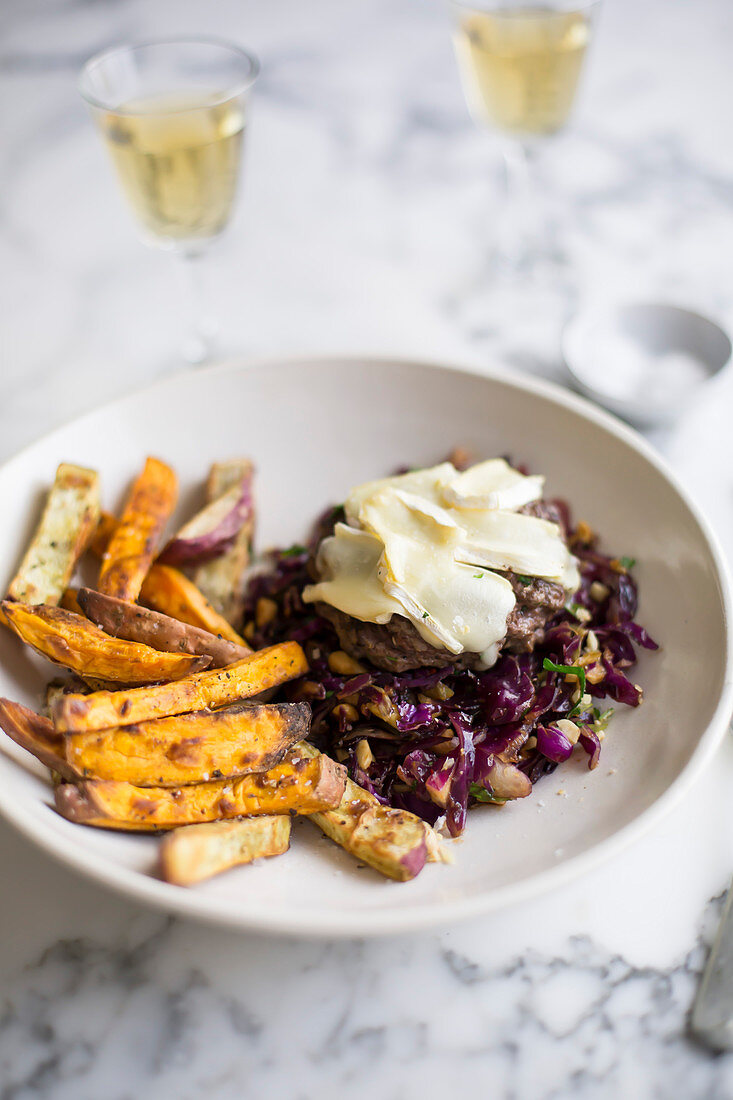 Burger with red cabbage slaw and sweet potato fries