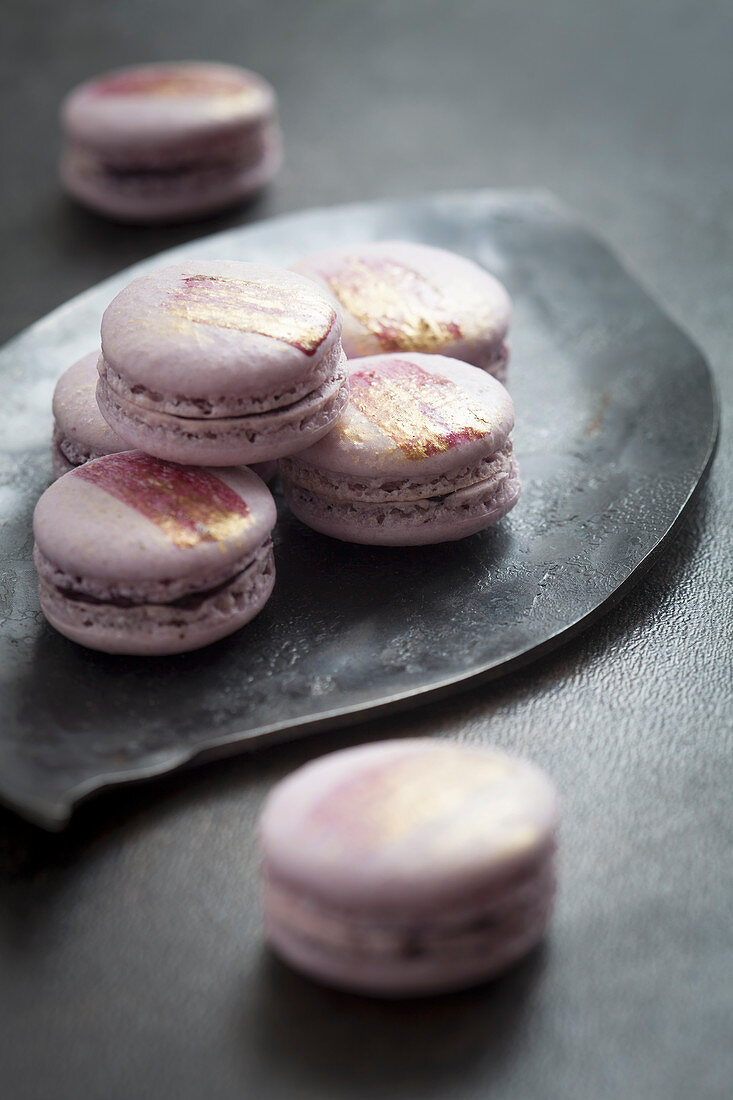 Homemade macarons with golden decoration