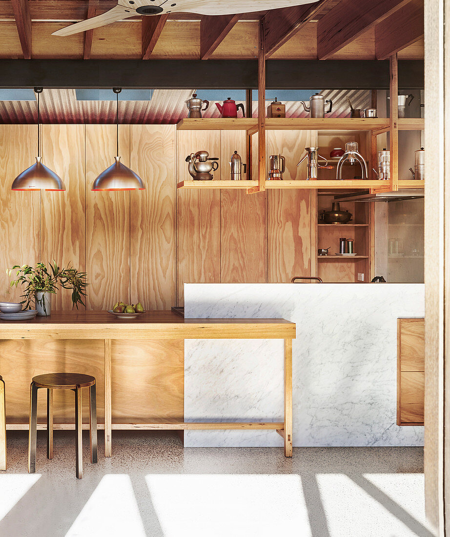 Custom-made kitchen made of wood and Carrara marble