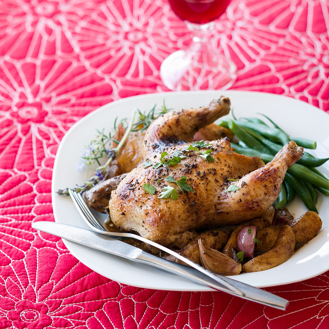 Roast chicken with potatoes, green beans, shallots and herbs