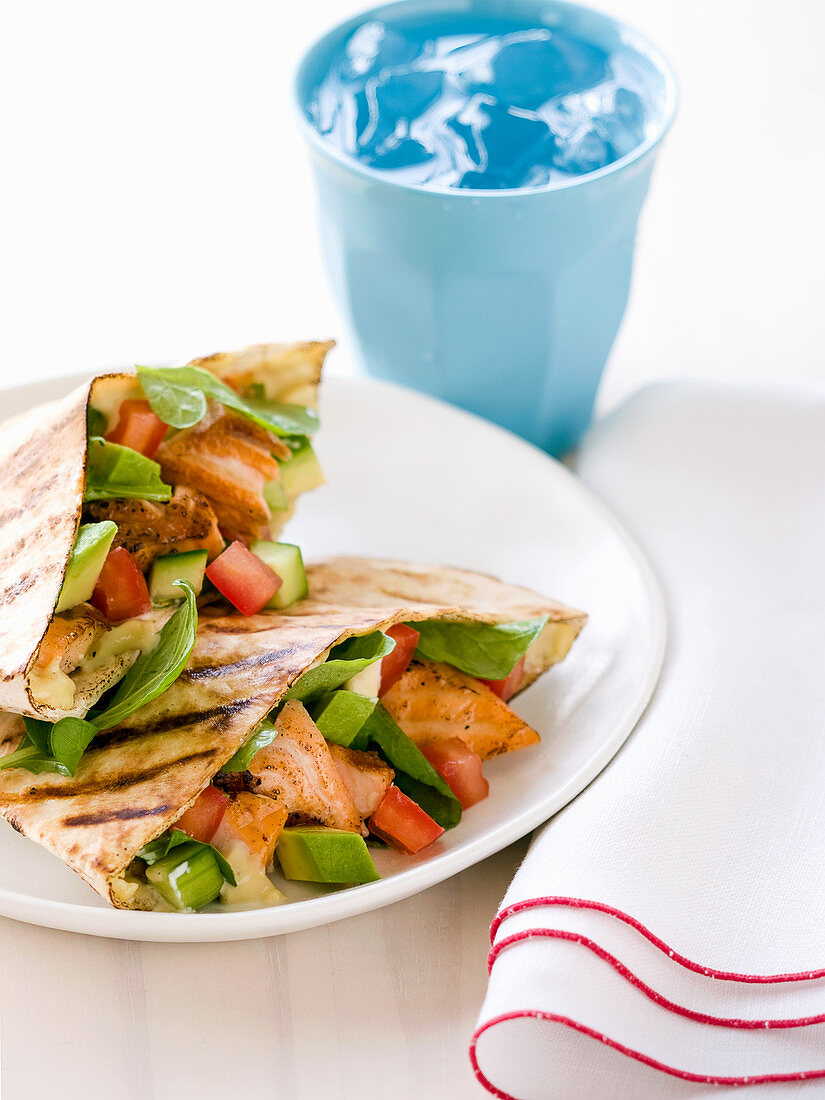 Grilled salmon and avocado pitta breads