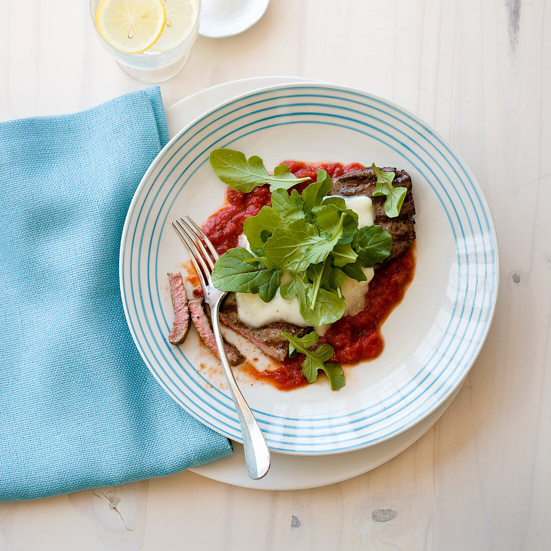 Warm steak salad with marinara sauce and cheese