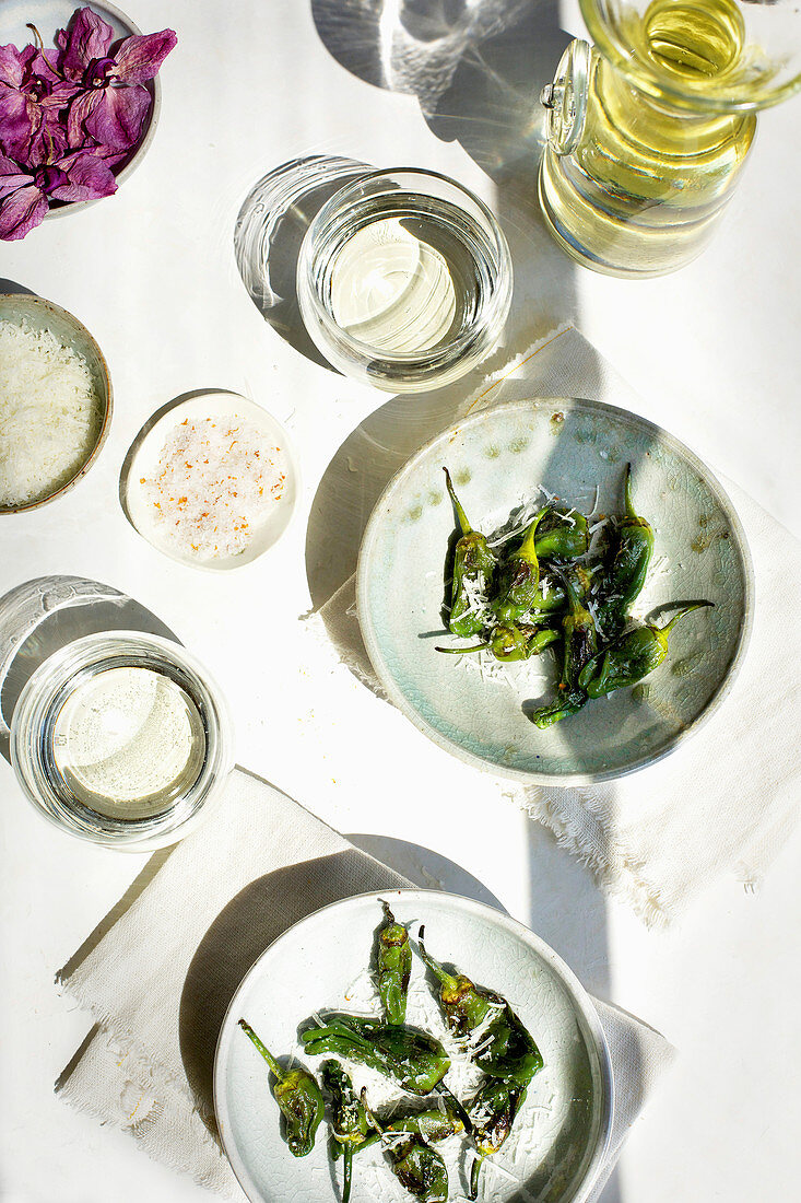 Roasted Padron Peppers with Mandarin Maldon Salt, served with white wine