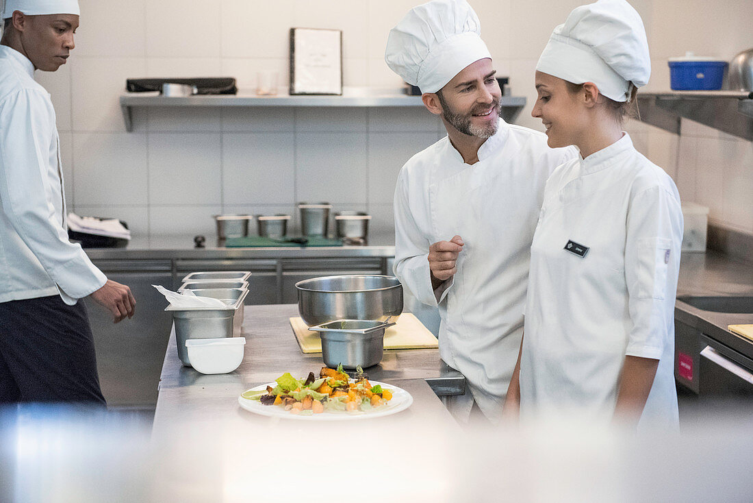 Chefs working together in a commercial kitchen
