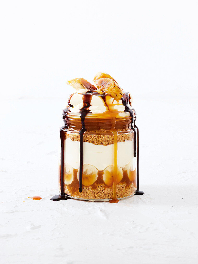 Banoffee with chocolate sauce in a jar