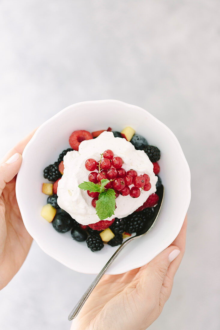Summer berries with whipped cream topping