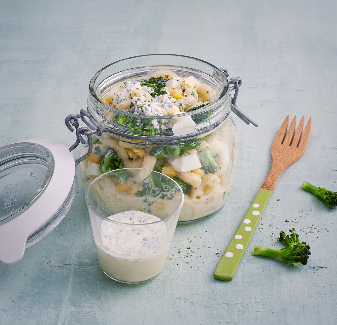 Pasta salad with hard-boiled egg, sweetcorn and herb cream cheese