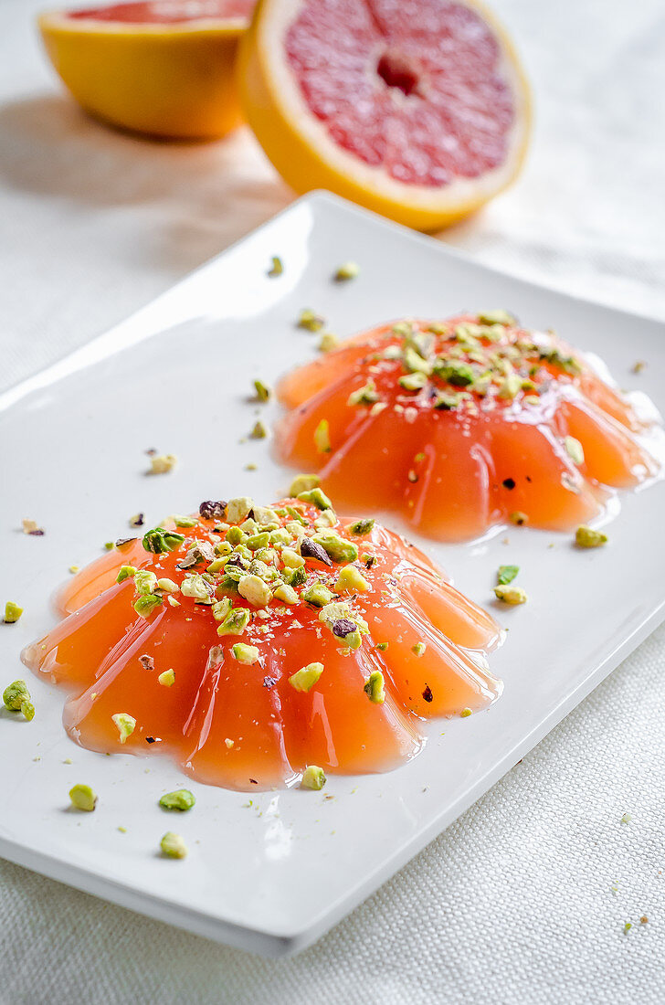 Pink grapefruit jelly with pistachio nuts