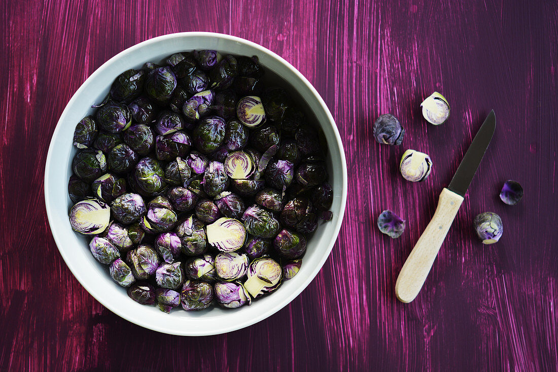 Fresh Brussels sprouts in a bowl of water