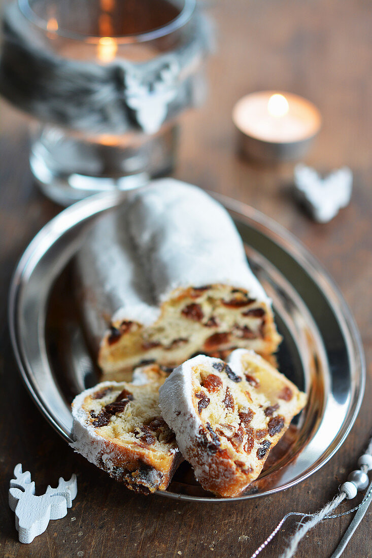 Christmas stollen, sliced, on a small tray