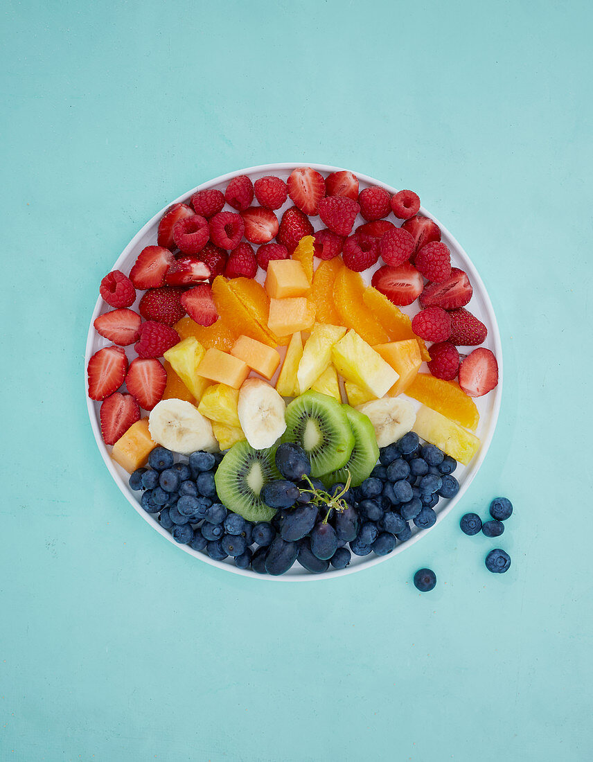 A rainbow of fresh fruit on a plate