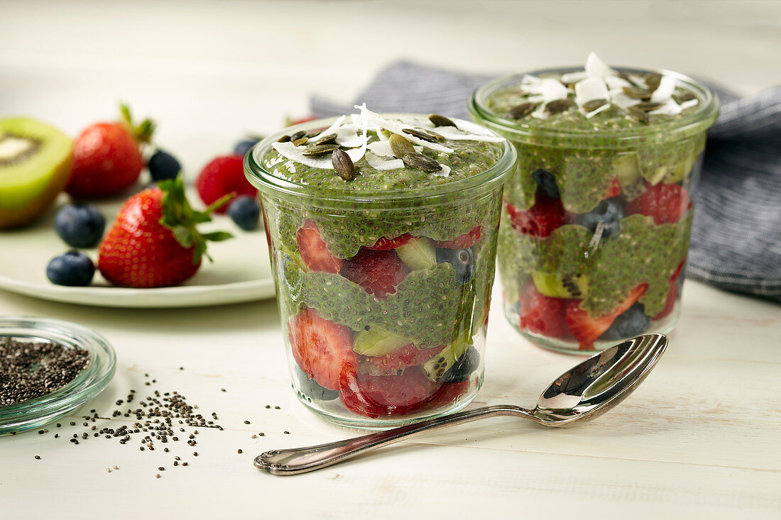 Matcha chia pudding with strawberries in glass jars