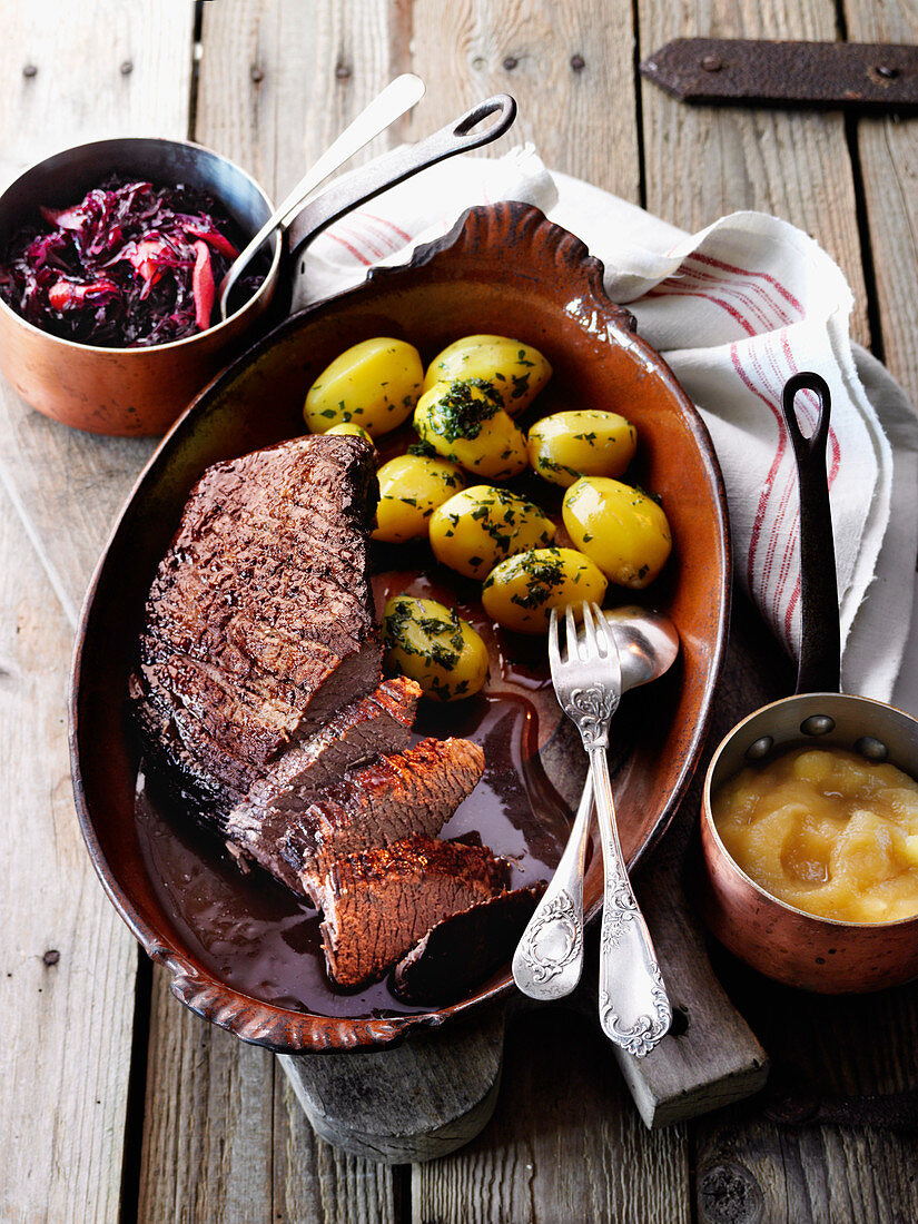 Braised roast beef in a red wine and chocolate sauce with elderberry red cabbage