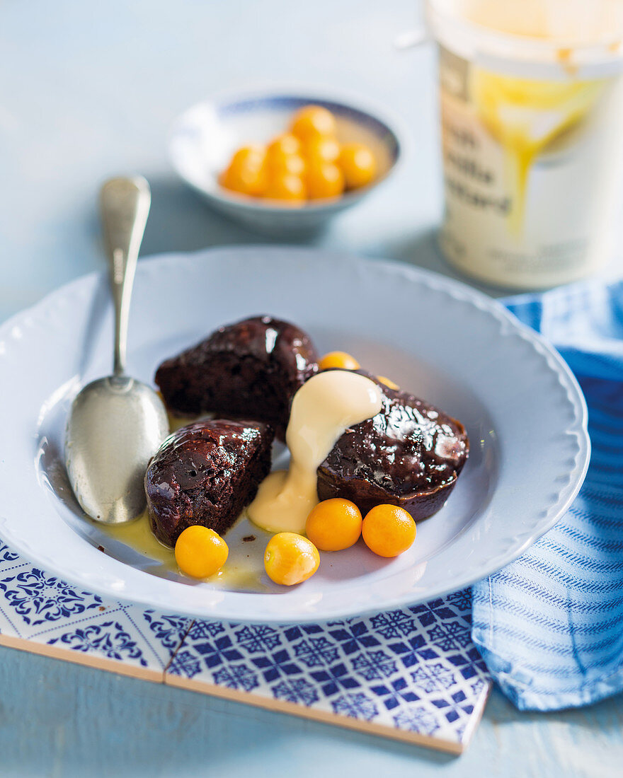 Chocolate malva puddings with white chocolate sauce and cape gooseberries