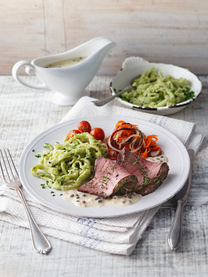 Roast beef with a creamy pepper sauce and herb Spätzle (soft egg noodles from Swabia)