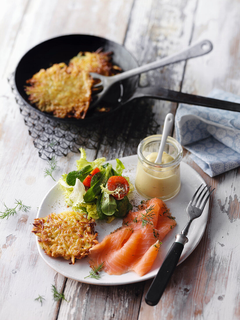 Smoked salad with fried Swiss potato cakes and salad