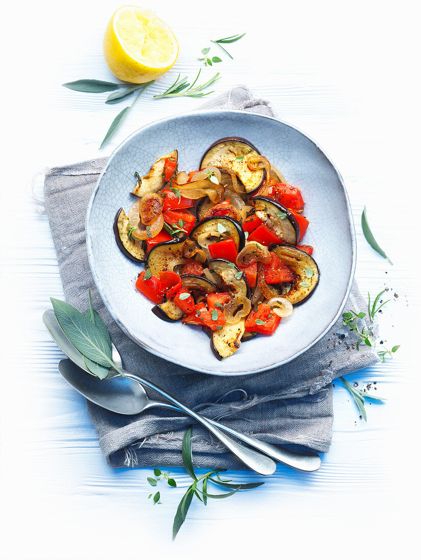 Eggplants with peppers and onions
