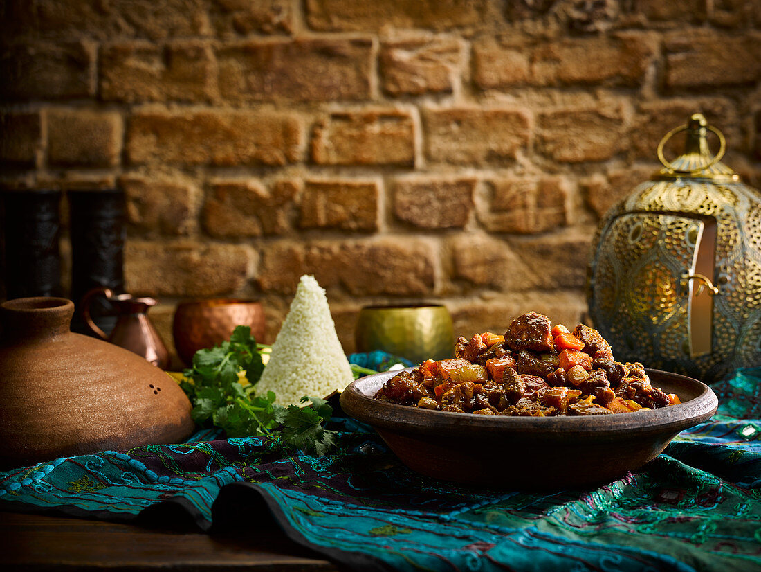 Game tagine with carrots and couscous