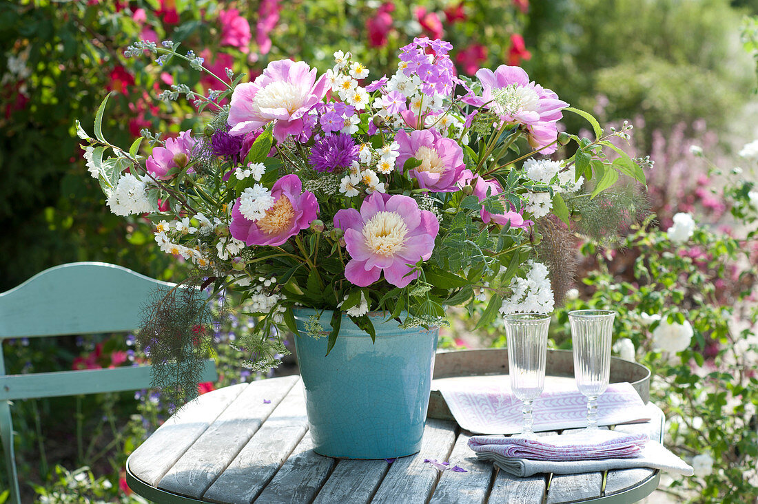 Paeonia 'Bowl of Beauty' (peonies), branches of Deutzia magnifica