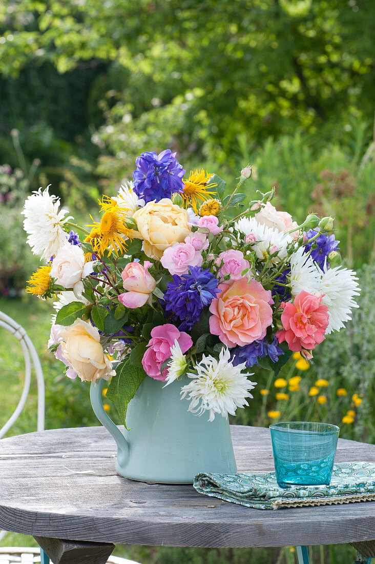 Colorful summer bouquet of rosa (roses), dahlia (dahlia), delphinium