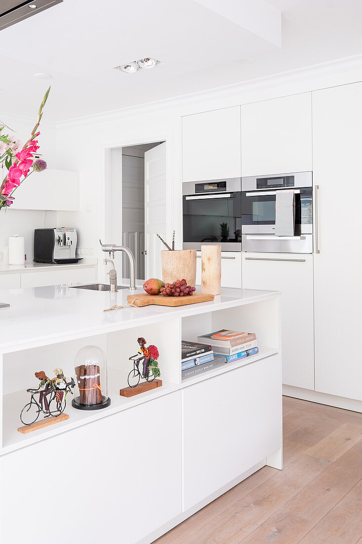 Island counter in white fitted kitchen