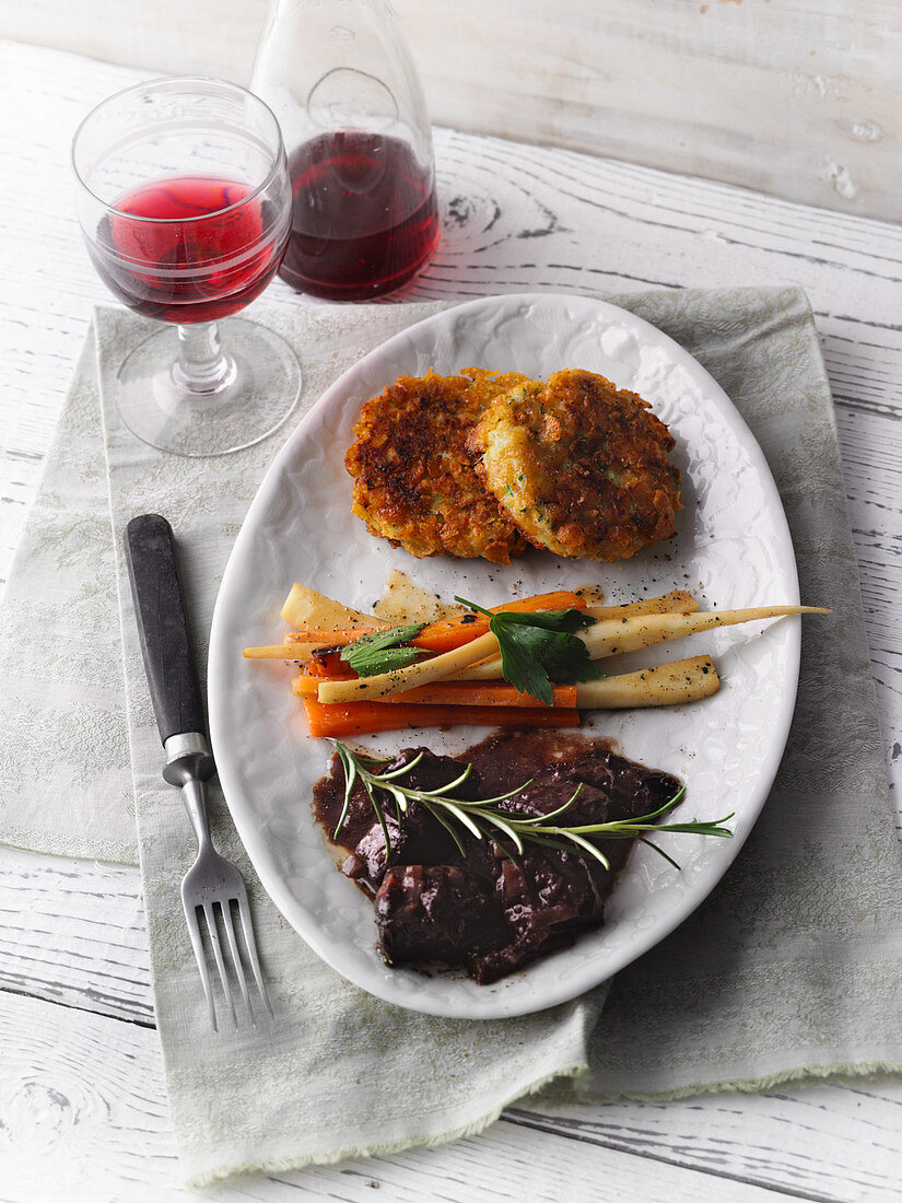 Bison ragout with potato cakes and root vegetables