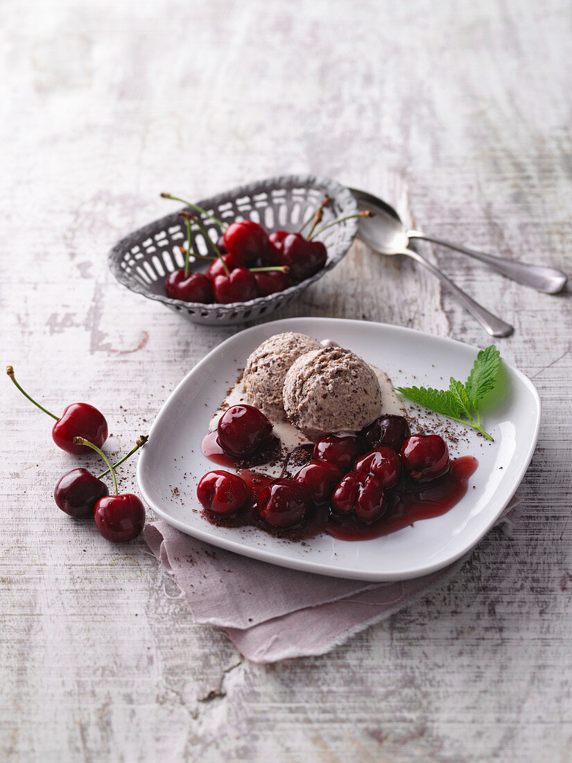 Chocolate ice cream with cherry compote