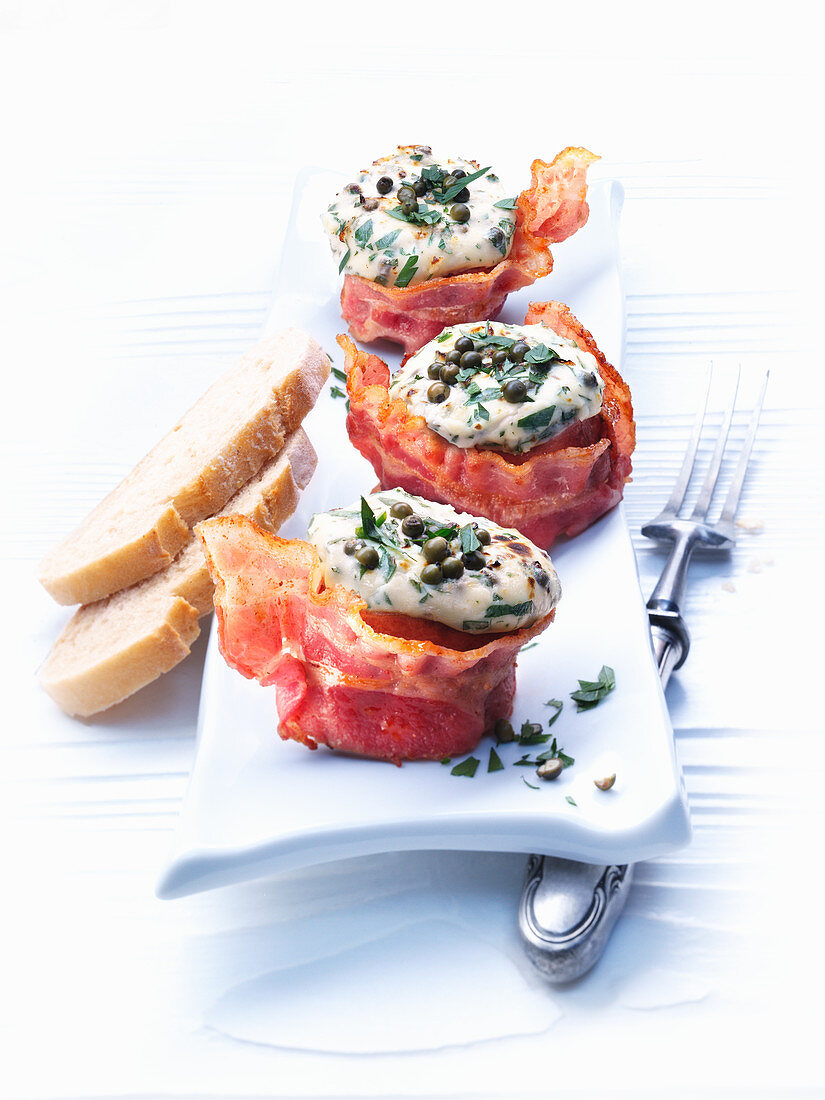 Baked filet slices wrapped in bacon