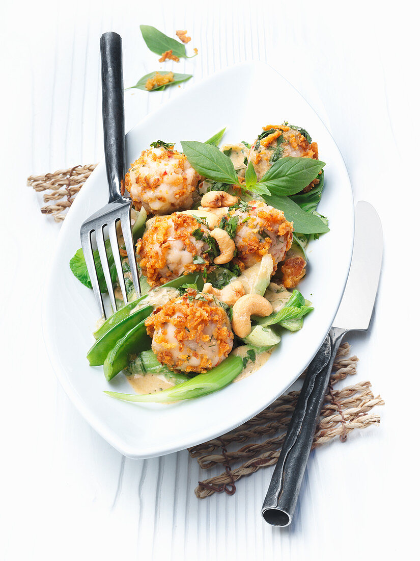 Shrimp balls with green curried vegetables and cashews