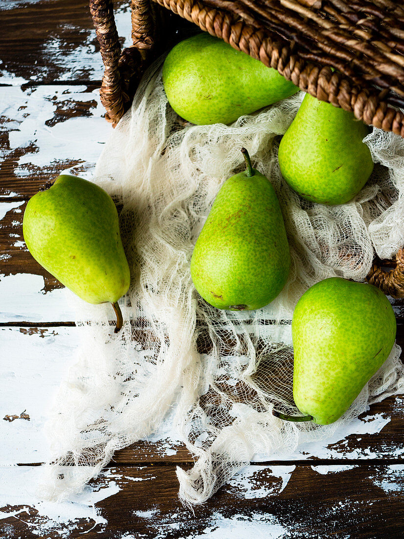 Green pears and basket