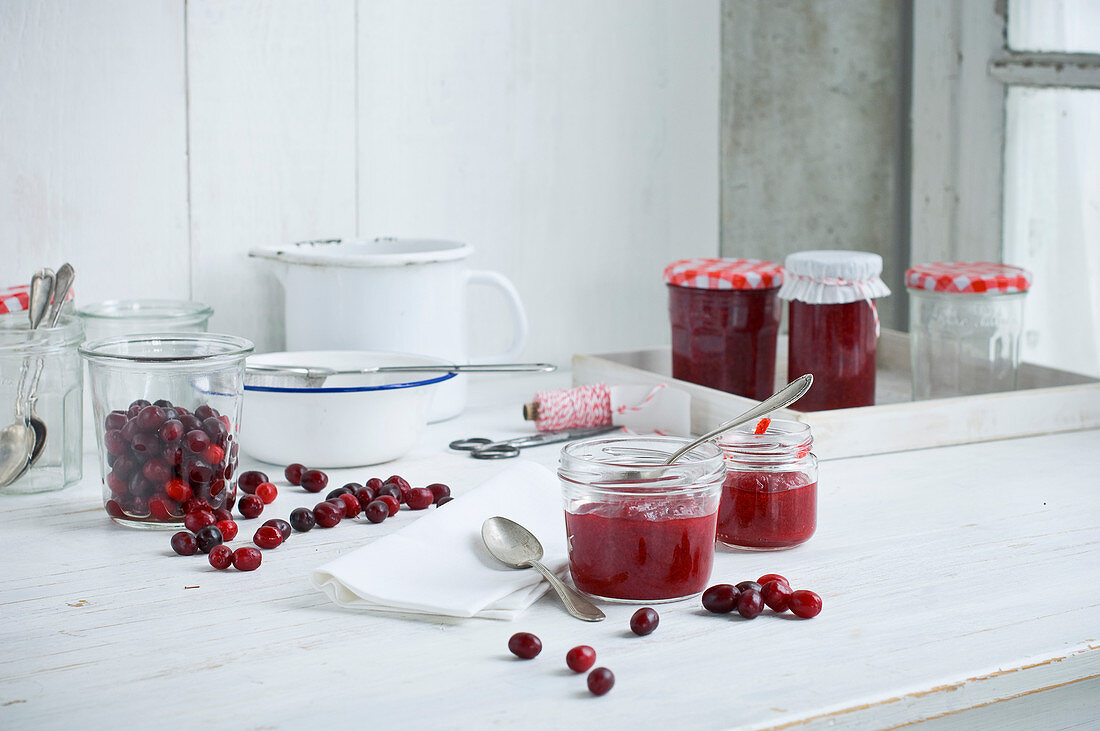 Cornelian cherry jam in storage jars