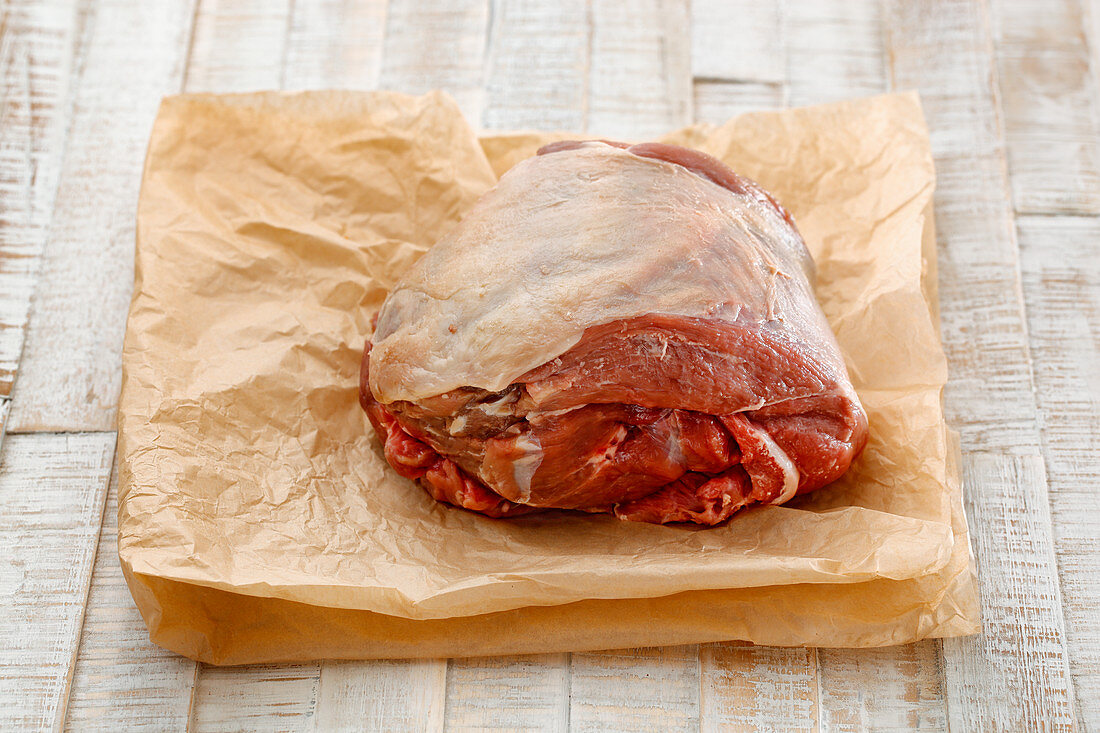 A leg of lamb on baking paper