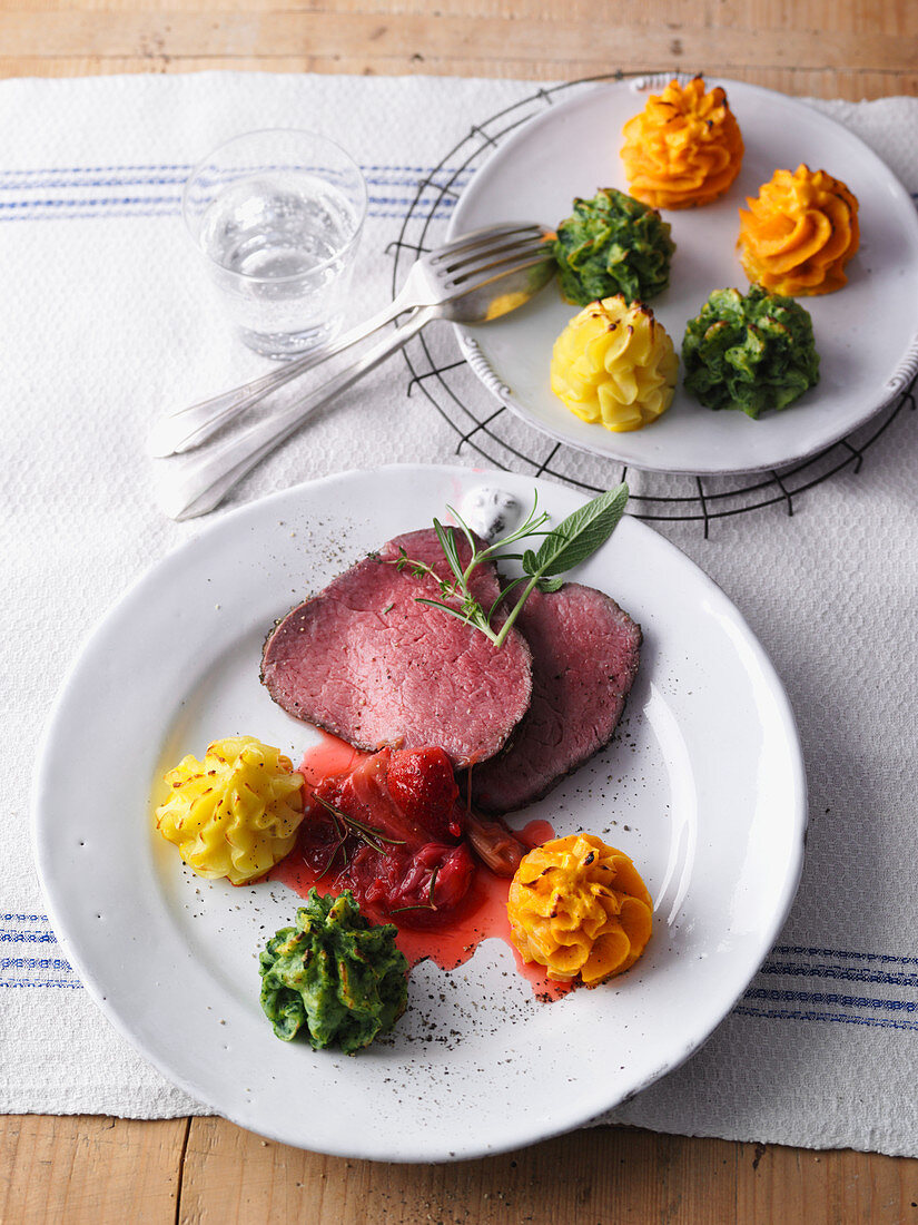 Beef fillet with colourful piped mashed potatoes and rhubarb