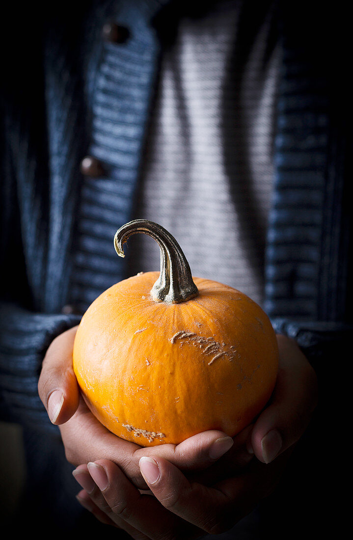 Man holding pumpkin