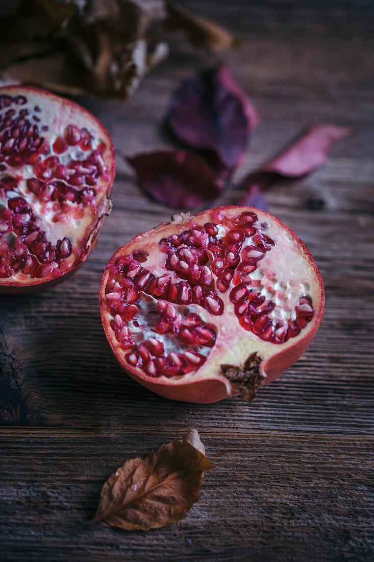 Pomegranate on a rustic wooden table