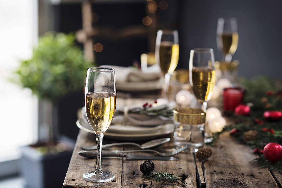 Champagne glasses on christmas table setting