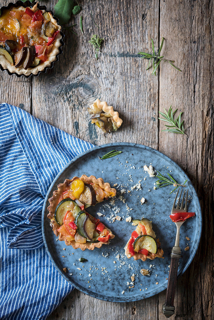 Vegetarian pastry tarts in a rustic kitchen