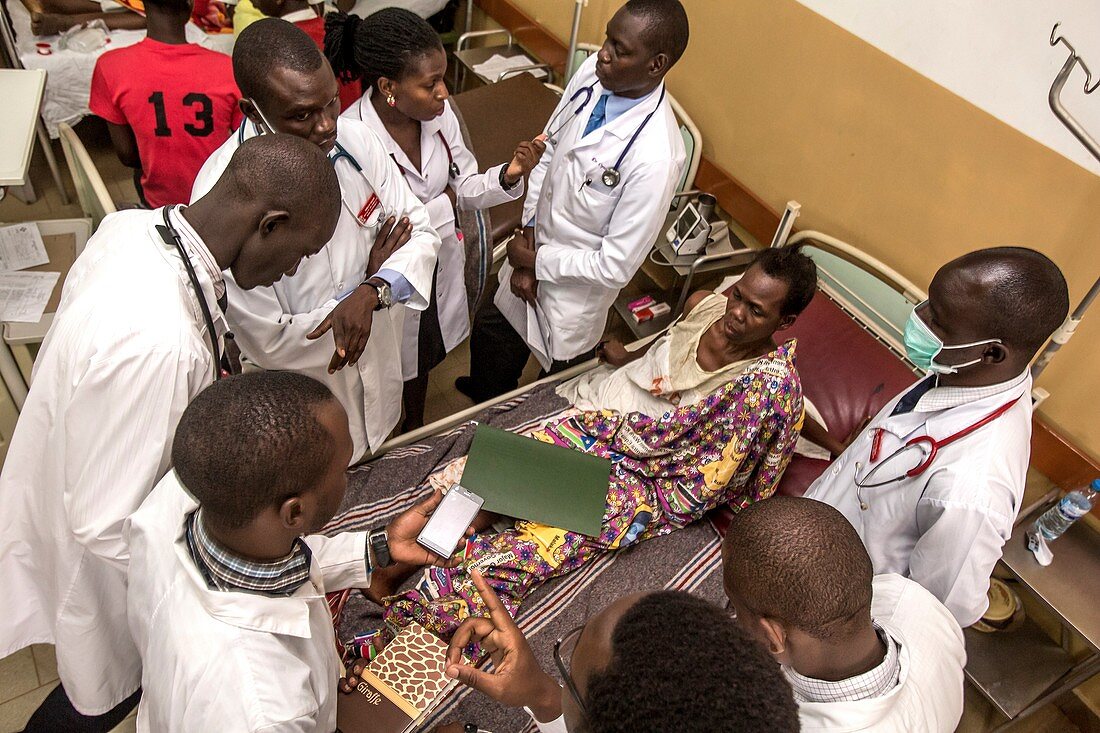 Medical students and doctors with a patient
