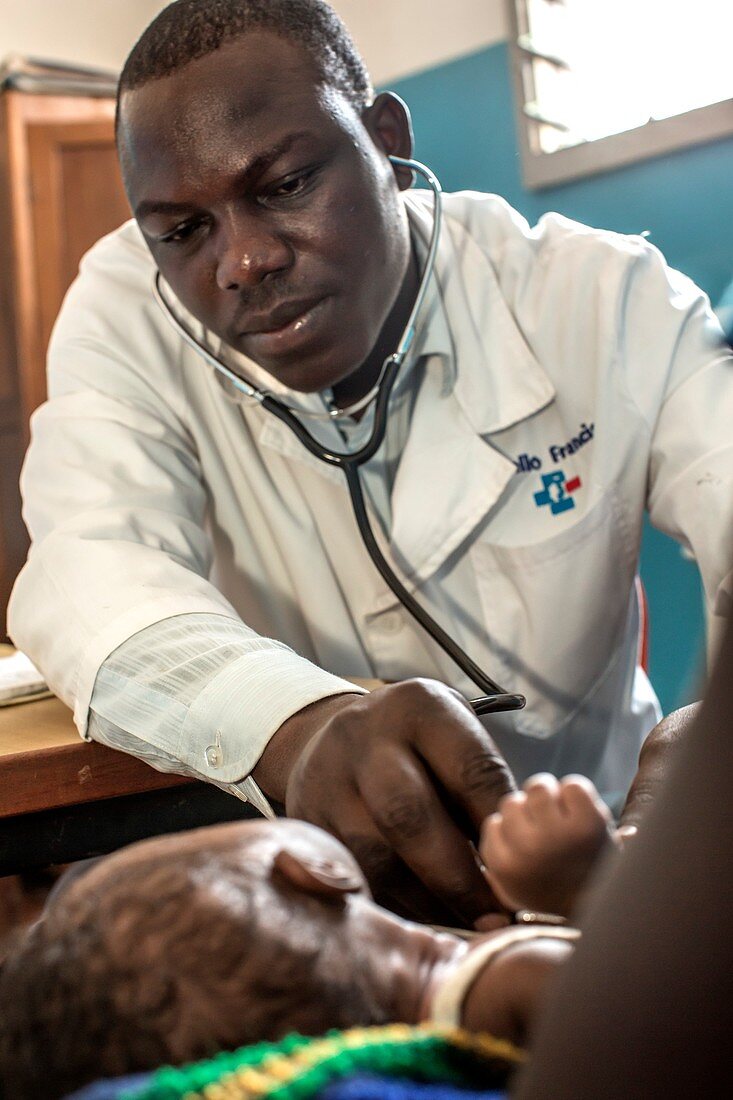 Hospital doctor examining child