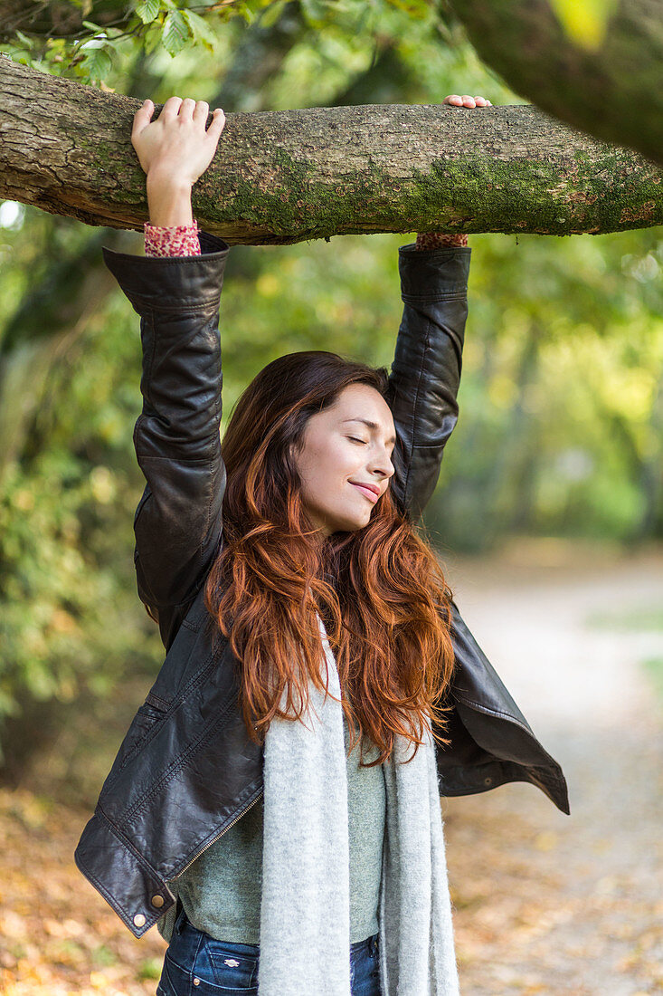 Woman hanging from a tree