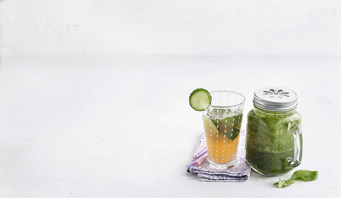 Green smoothie and cucumber and ginger water