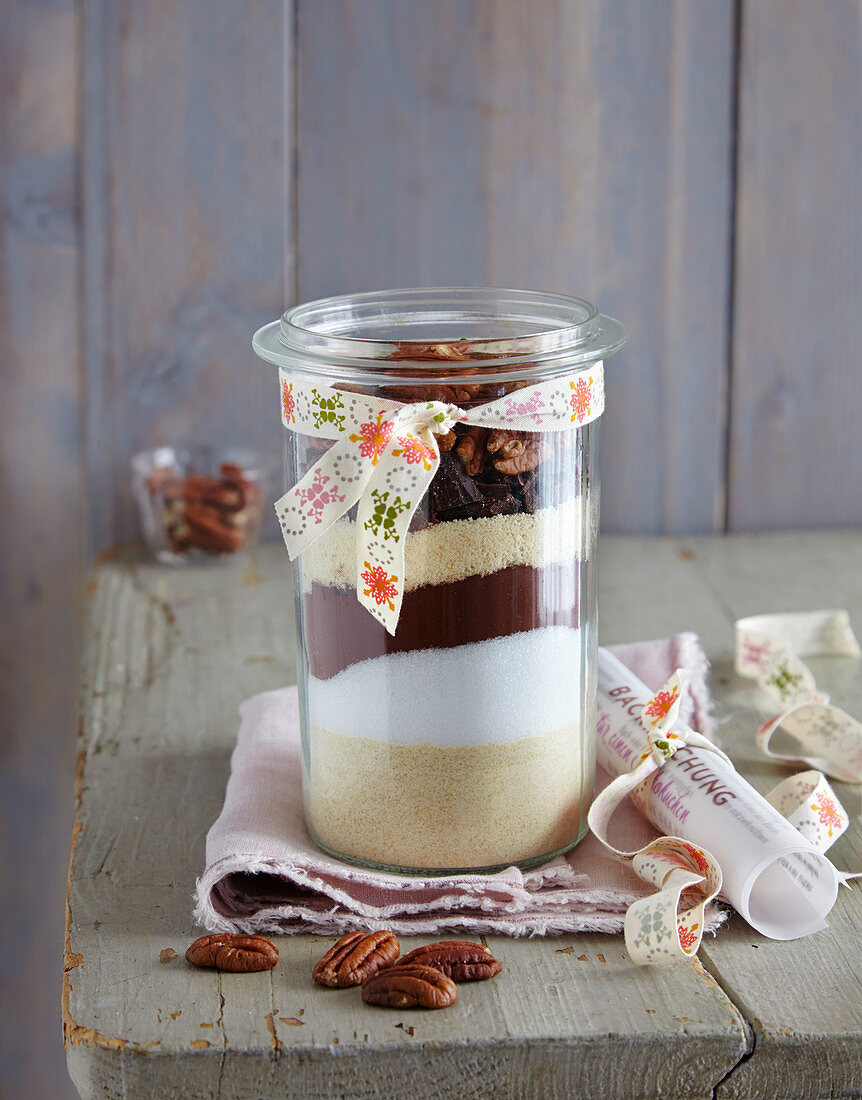 Ingredients for chocolate cake layered in a jar