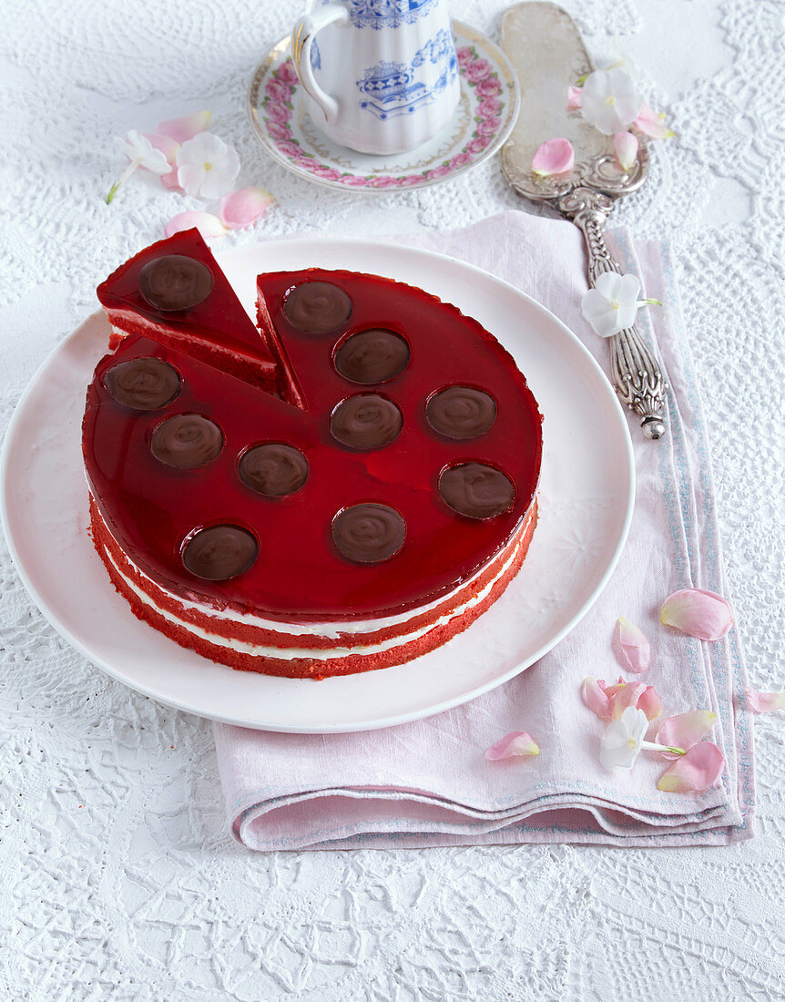 A red cake with mascarpone cream and cherry juice