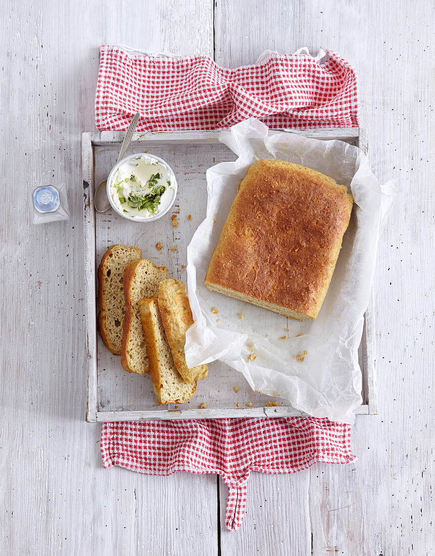 A loaf of home-made bread with cream cheese