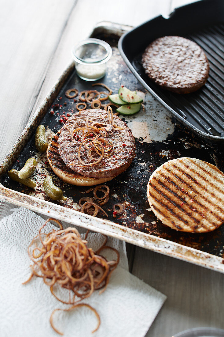 Burger with braised onions and gherkins