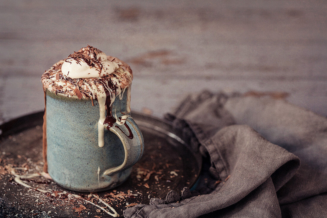 Luxury hot chocolate with dark, milk and white chocolate and fresh whipped cream