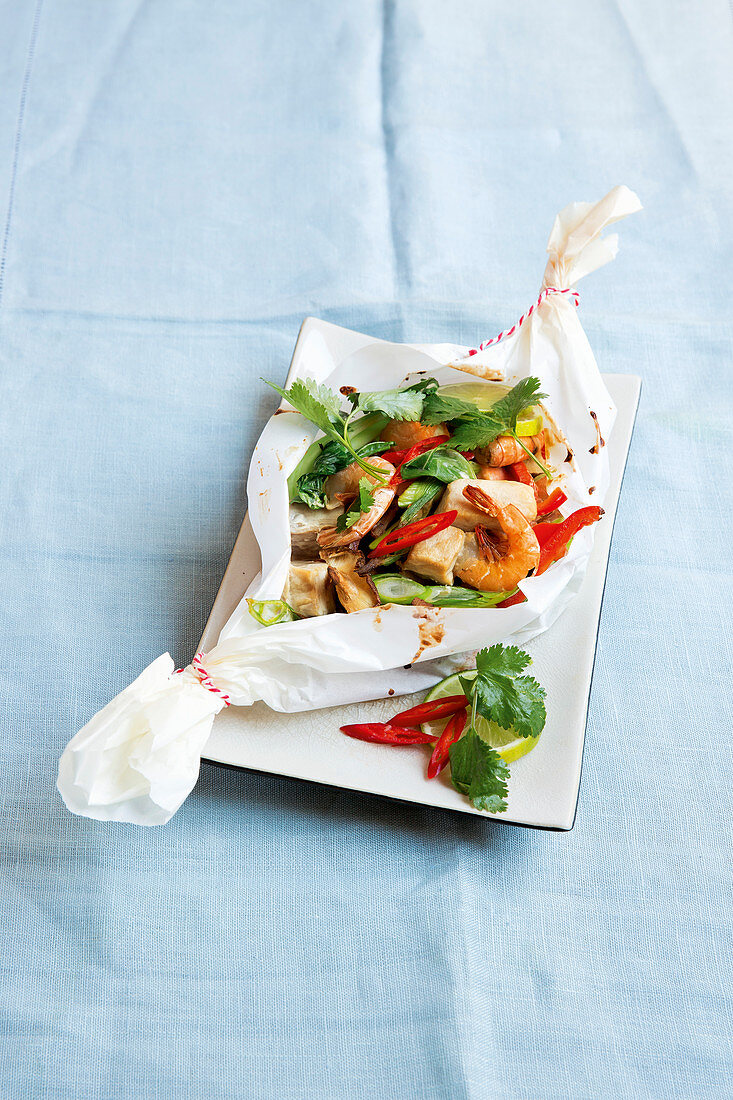 Asian fish parcels wrapped in baking paper